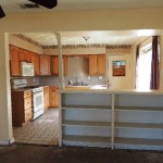 VIEW OF KITCHEN FROM LIVING ROOM