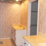 master bath with dual vanities and walk-in closet