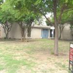 Front of house as viewed from corner of lot
