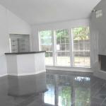 second view of living area with wet bar and view to large side y