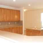 View 2 of kitchen with wall of cabinets for all of your storage